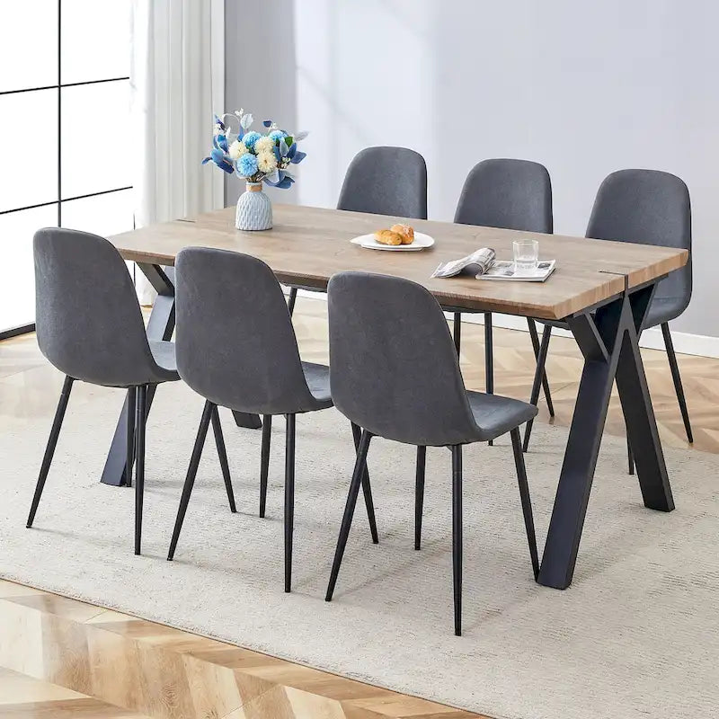 Ensemble de salle à manger moderne avec table rectangulaire noire à piètement en A et chaises à dossier rond